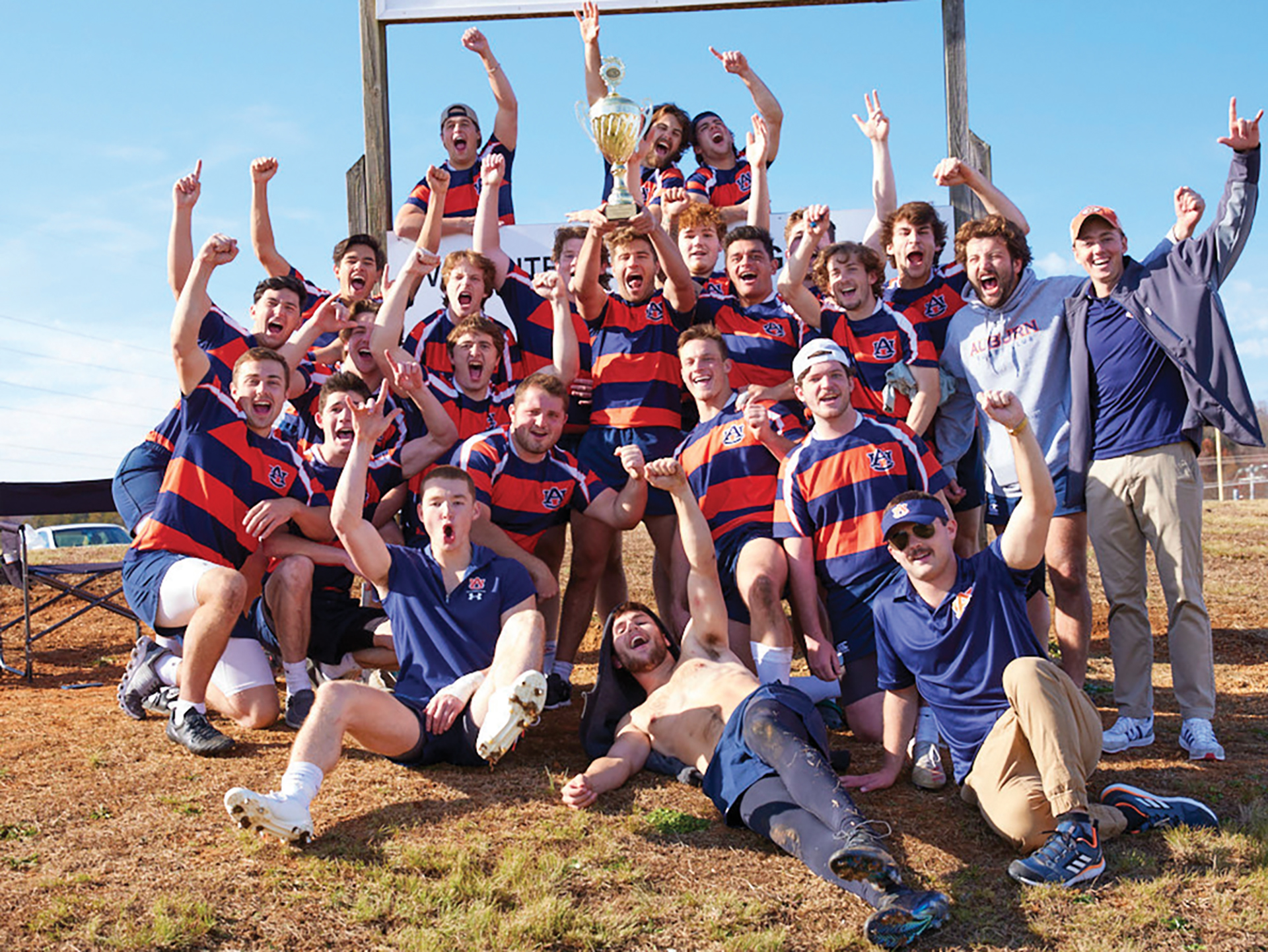 Rugby team cheering in their jerseys