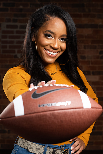 Chelsea Phillips holding a football